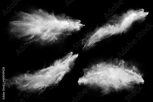 Set of dust powder clouds on black background