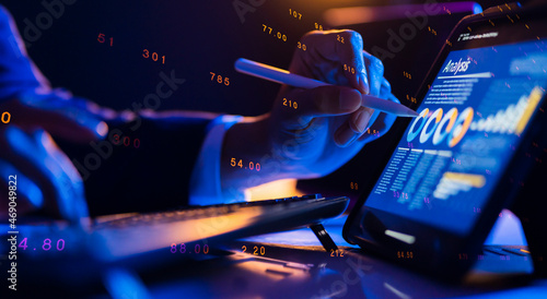 Smart businessman hand close up DeFi NFT financial data on mobile laptop futuristic stock chart graphic, Business investor stock exchange market and crypto currency data analytics digital technology