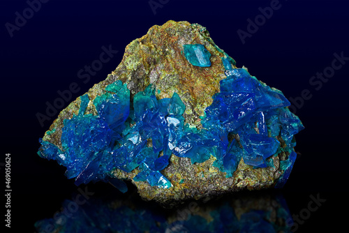 Chalcanthite (blue copper sulphate) on black background  photo