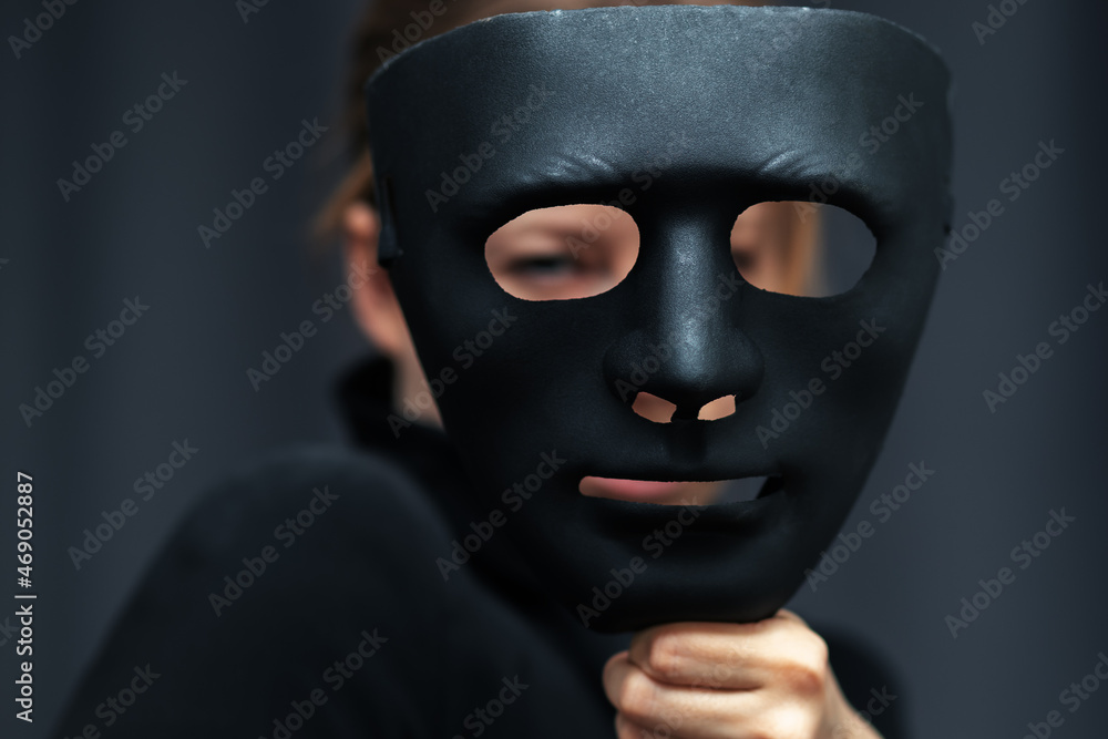 espionage mask, confidentiality of personal information on the web, anonymous search and use of the Internet,woman with black mask espionage mask, confidentiality of personal information on the web, anonymous search and use of the Internet,woman with black mask
