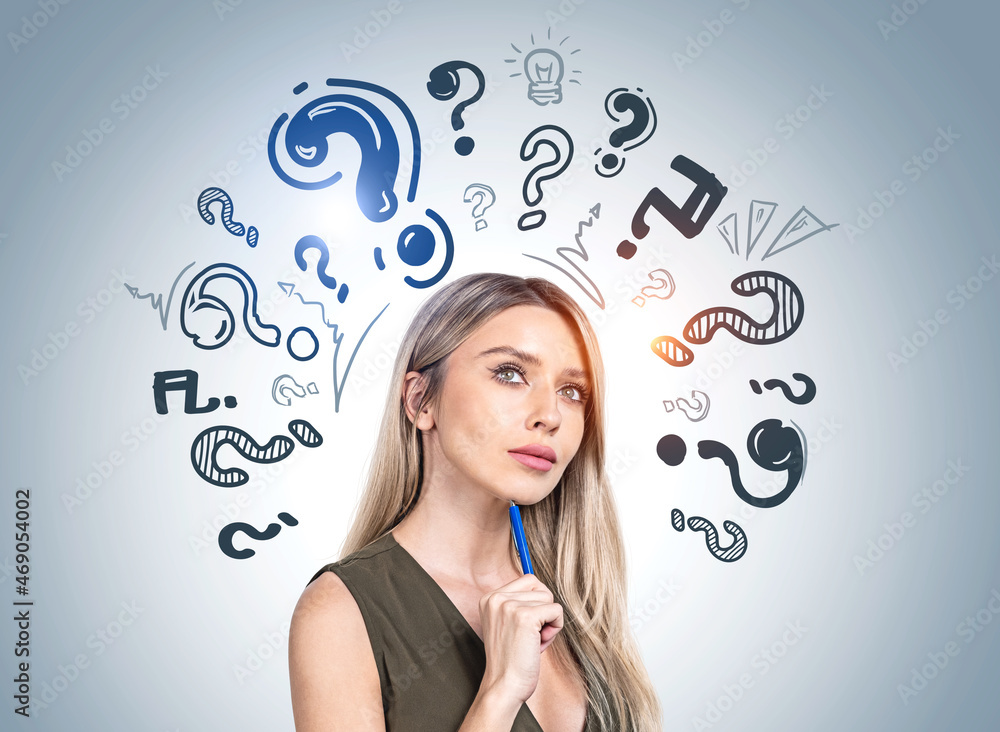 Businesswoman portrait with pensive look, set of question marks Businesswoman portrait with pensive look, set of question marks