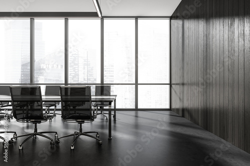 Dark conference interior with furniture and panoramic windows with city view