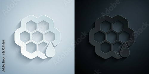 Paper cut Honeycomb icon isolated on grey and black background. Honey cells symbol. Sweet natural food. Paper art style. Vector
