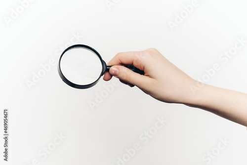 magnifier in hand tool search lcd light background