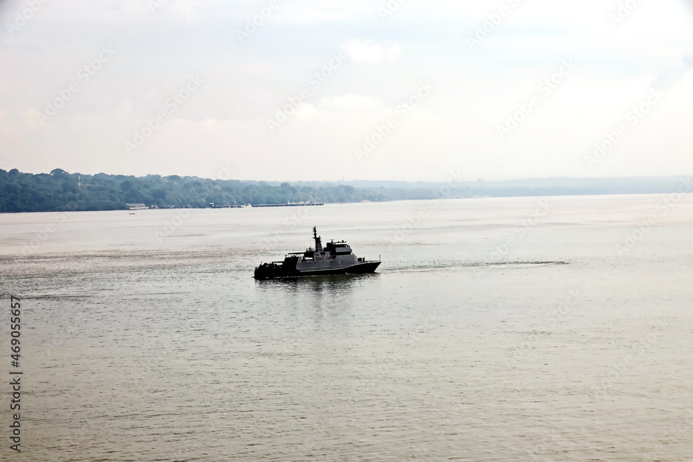 Vessels, passenger ships and tugboats in port under cargo operations and underway. Port of Surabaya, Indonesia, January,2021 Vessels, passenger ships and tugboats in port under cargo operations and underway. Port of Surabaya, Indonesia, January,2021