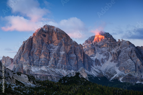 Dolomite Alps, Italy. View of the mountains and high cliffs during sunset. Natural landscape. Photo in high resolution.