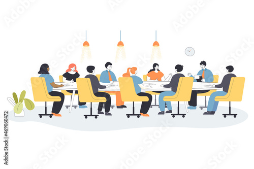Fototapeta Men and women sitting on chairs at round table in office boardroom