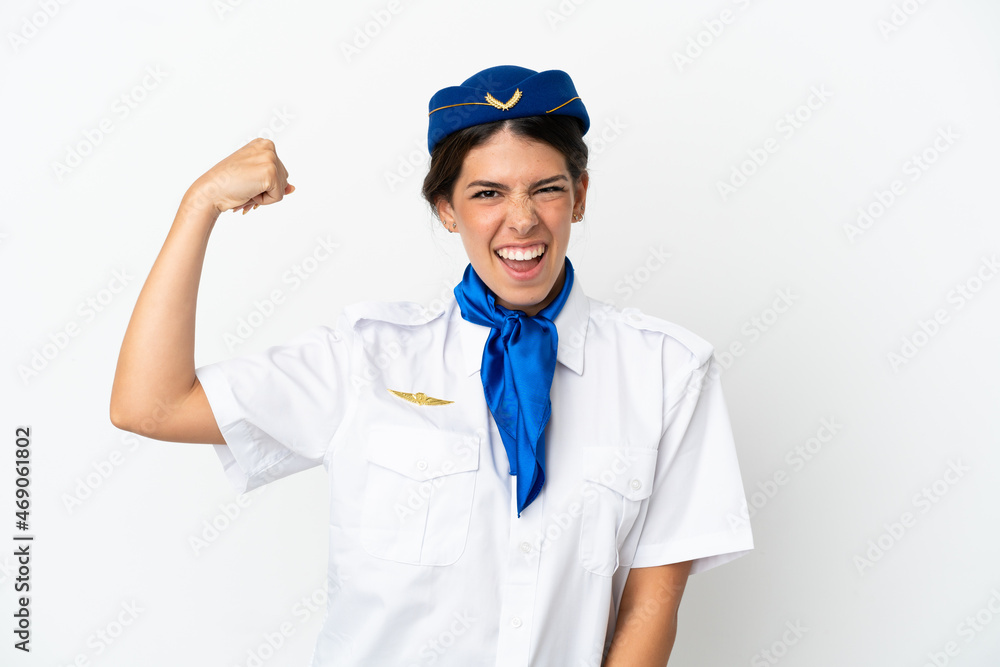 Airplane stewardess caucasian woman isolated on white background doing strong gesture