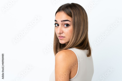 Young pretty brunette woman isolated on white background