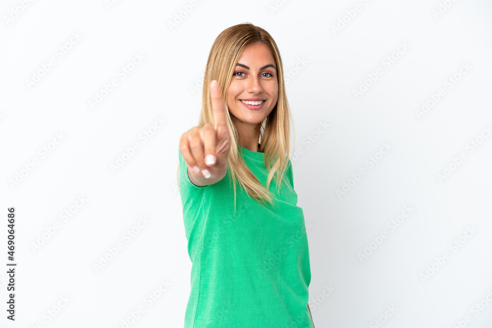 Blonde Uruguayan girl isolated on white background showing and lifting a finger Blonde Uruguayan girl isolated on white background showing and lifting a finger