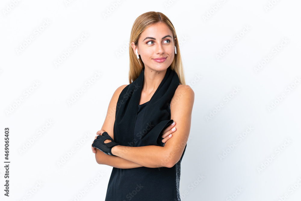 Blonde Uruguayan sport girl isolated on white background looking side Blonde Uruguayan sport girl isolated on white background looking side