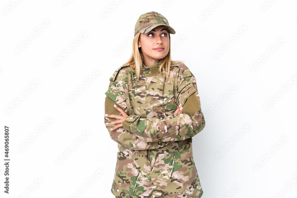 Military woman isolated on white background making doubts gesture while lifting the shoulders Military woman isolated on white background making doubts gesture while lifting the shoulders