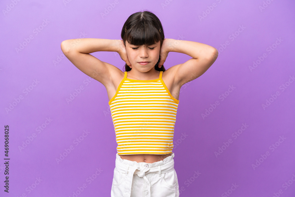 Little caucasian kid isolated on purple background frustrated and covering ears Little caucasian kid isolated on purple background frustrated and covering ears