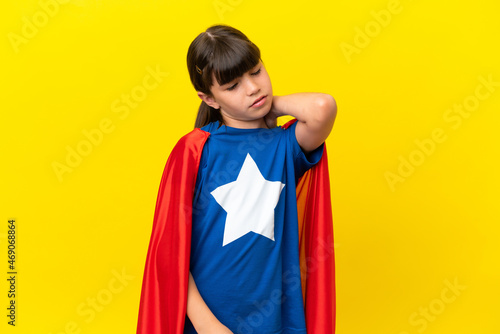 Little super hero kid isolated on purple background with neckache