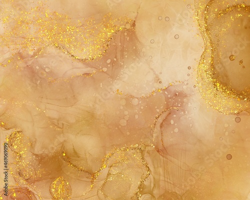 Abstract gold yellow liquid fluid art alcohol inks splash background with glitter 
