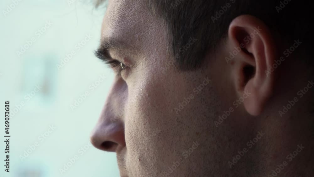 man's eyes looking out the window close-up man's eyes looking out the window close-up