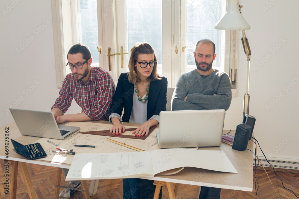 Three colleagues working from home on a project. Three colleagues working from home on a project.
