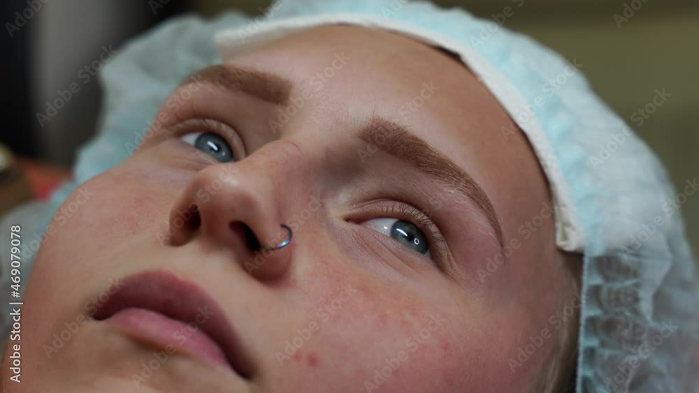 Eyelash extension procedure. Woman eye with long eyelashes. Eyelashes, close-up, macro, selective focus. 4K Eyelash extension procedure. Woman eye with long eyelashes. Eyelashes, close-up, macro, selective focus. 4K