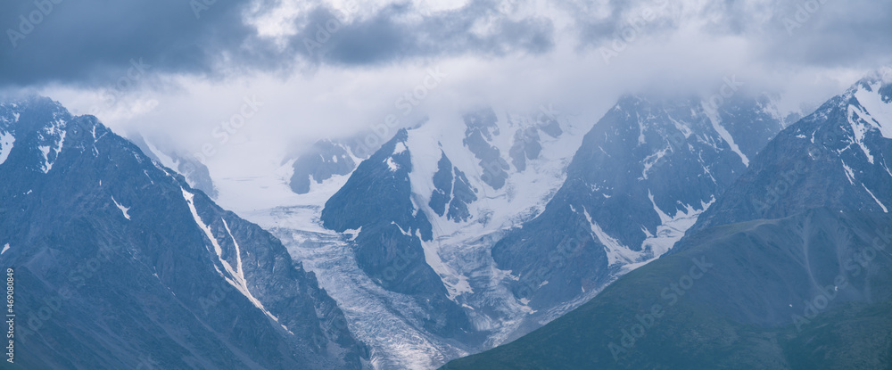 Mountain peaks in the clouds, panoramic view