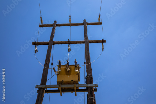 Electrical transformer against a blue sky