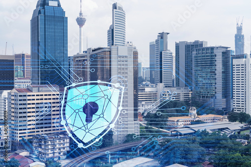 Photography Hologram of padlock icons over panoramic city view of Kuala Lumpur to protect business, Malaysia, Asia