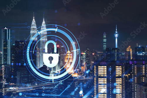 Photography Glowing padlock hologram, night panoramic city view of Kuala Lumpur, Malaysia, Asia