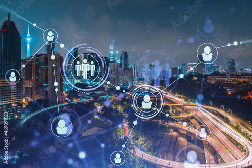 Photography Glowing social media icons on night panoramic city view of Kuala Lumpur, Malaysia, Asia