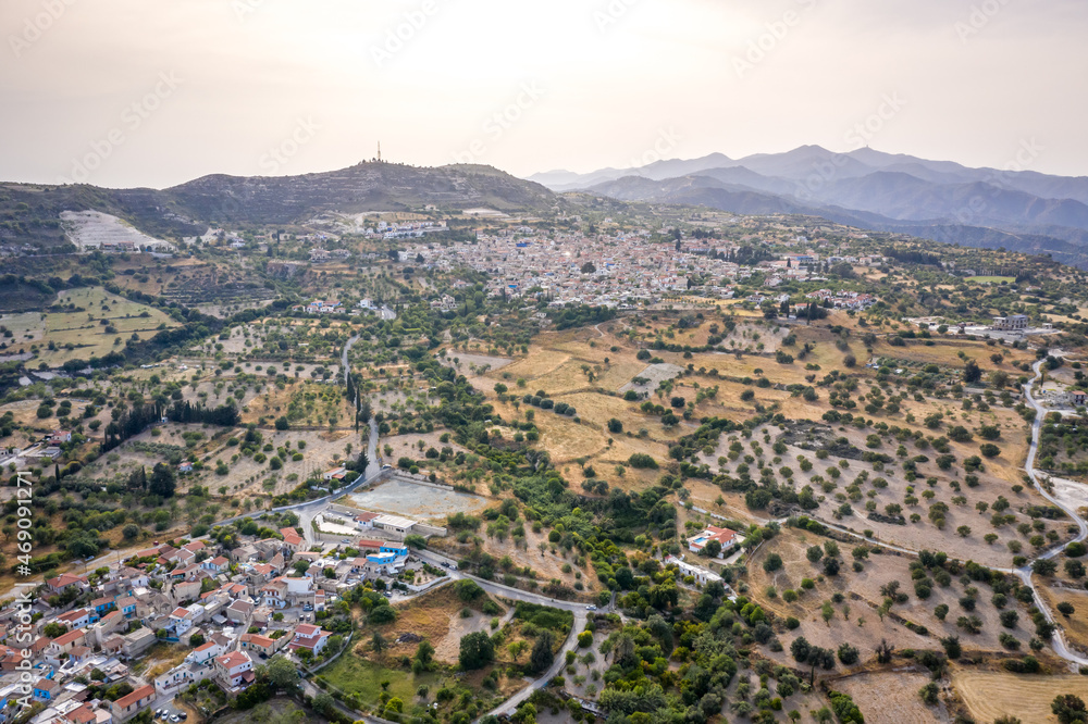 Aerial view of famous landmark tourist destination valley Pano Lefkara village, Larnaca, Cyprus. Ceramic tiled house roofs, greek orthodox church at south of Troodos hills, Kionia, from above