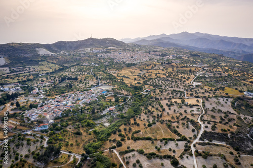 Aerial view of famous landmark tourist destination valley Pano Lefkara village, Larnaca, Cyprus. Ceramic tiled house roofs, greek orthodox church at south of Troodos hills, Kionia, from above