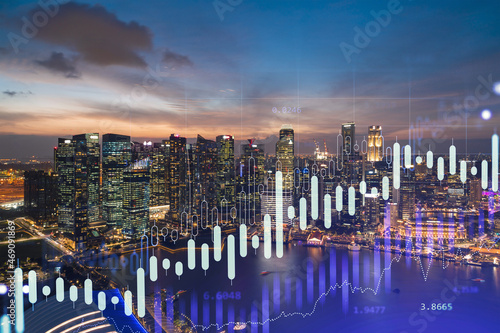 Stock market graph hologram  night panorama city view of Singapore  popular location to gain financial education in Asia. The concept of international research. Double exposure.