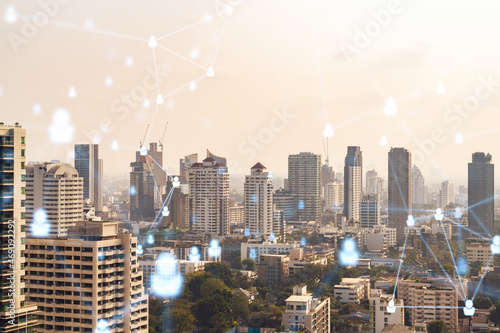 Social media icons hologram over panorama city view of Bangkok  Southeast Asia. The concept of people networking  connections and career opportunities. Double exposure.