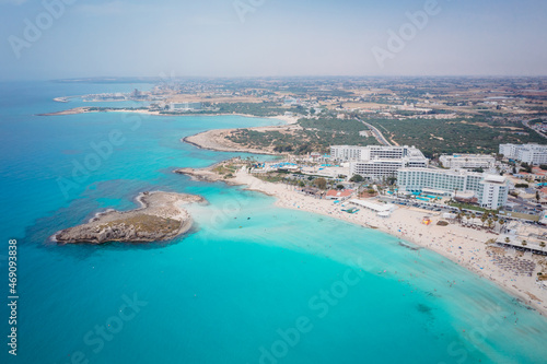 Fototapeta Naklejka Na Ścianę i Meble -  Aerial view of the most famous beaches in Cyprus - Nissi Beach. White sand beach with azure waters. Beautiful beach and panoramic views of Cyprus