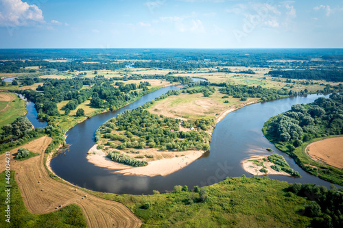 aerial landscape of winding river Klyazma in green field, top view of beautiful nature texture from drone. Vladimir city Russia