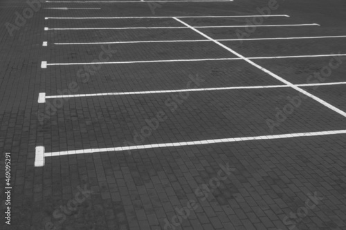 Empty car parking lots with white marking lines outdoors