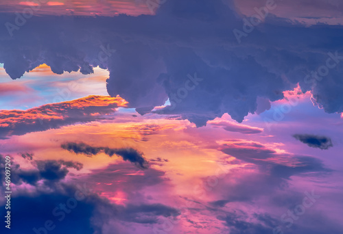 The sun shines through the clouds in the sky. The shape of the clouds evokes imagination and creativity. They can be used as wallpapers that look amazing. Copy space, No focus, specifically.
