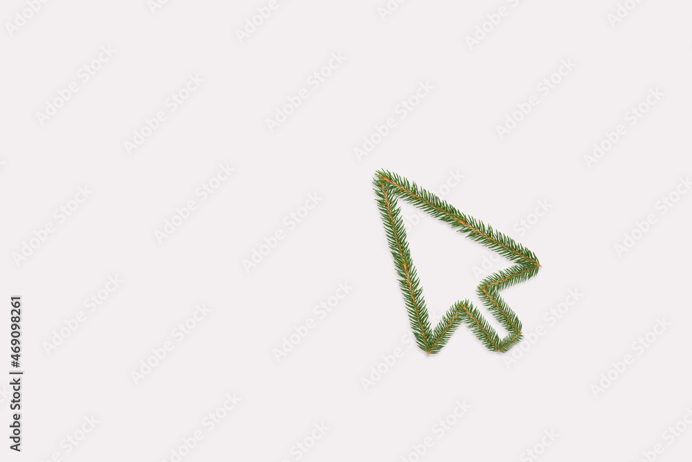 Christmas shopping concept with mouse cursor made of branches. Flat lay Christmas shopping concept with mouse cursor made of branches. Flat lay
