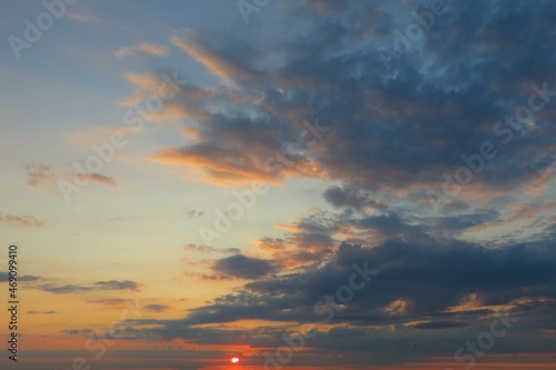 Fototapeta Naklejka Na Ścianę i Meble -  Sunset in the sky with dark dramatic clouds, natural background
