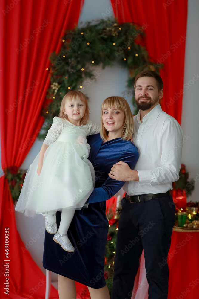 Family photo with the whole family in beautiful outfits Family photo with the whole family in beautiful outfits