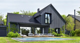 Black house with pool. Modern architecture