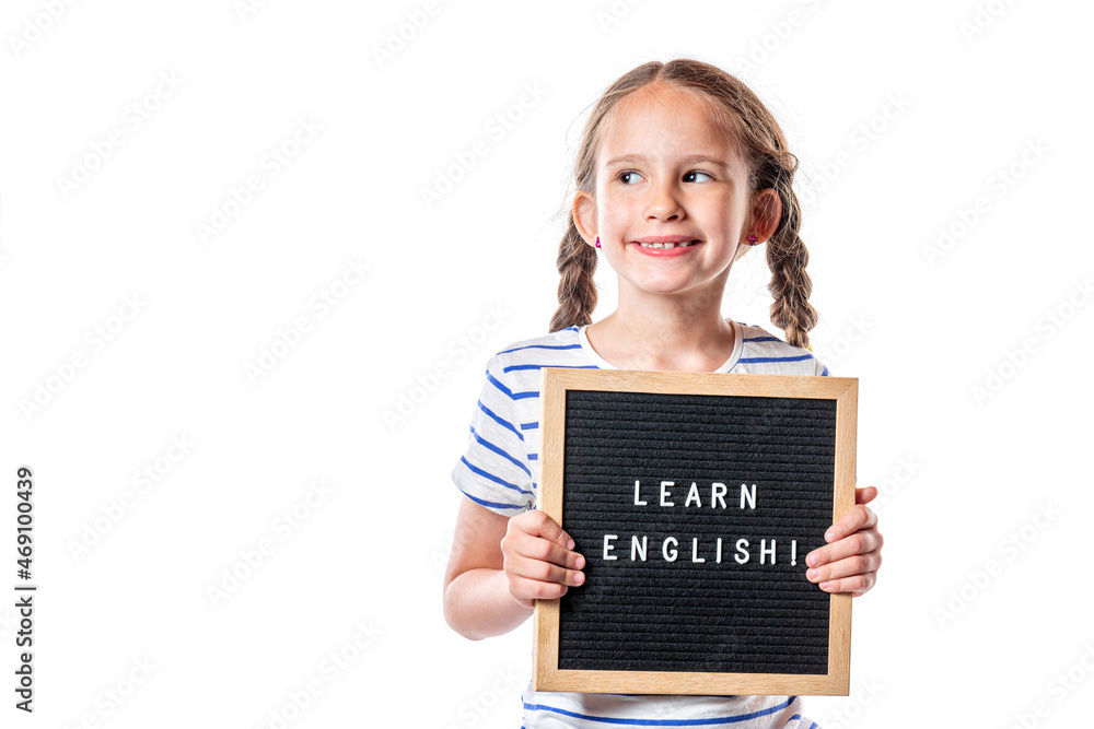 Cute little european girl with letterboard Learn English isolated on white background. English school. Free space for your text Cute little european girl with letterboard Learn English isolated on white background. English school. Free space for your text
