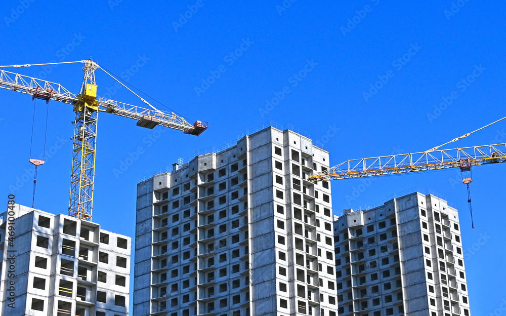 Crane and highrise construction site Crane and highrise construction site