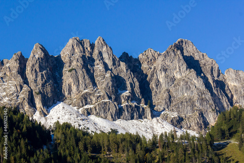 The Gosaustein mountain ridge with sunny autumn weather and blue sky  Filzmoos  Austria 