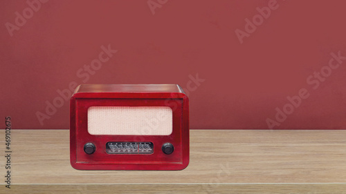 old radio standing on wooden floor
