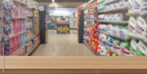 empty wooden floor in front of supermarket background
