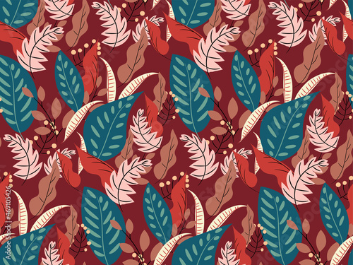 Tropical leaves seamless pattern. Foliage of plants, berries on a rich red (b...