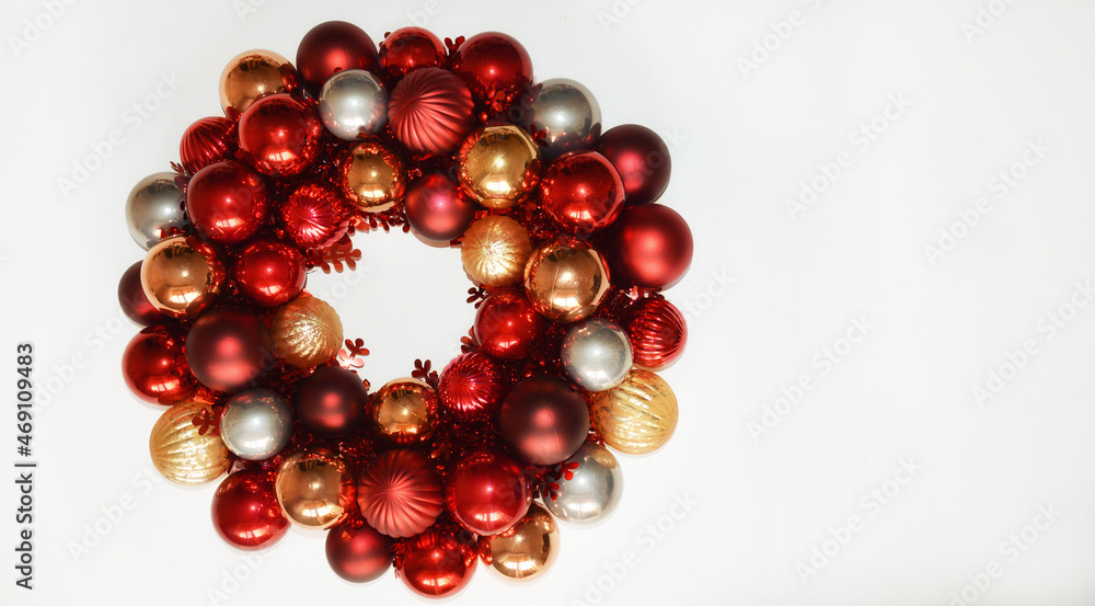 Christmas wreath on the door made of balloons. decor for decorating the interior for Christmas and New Year. Shiny multicolored balls. Christmas wreath on the door made of balloons. decor for decorating the interior for Christmas and New Year. Shiny multicolored balls.