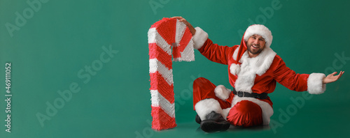Santa Claus with candy cane...