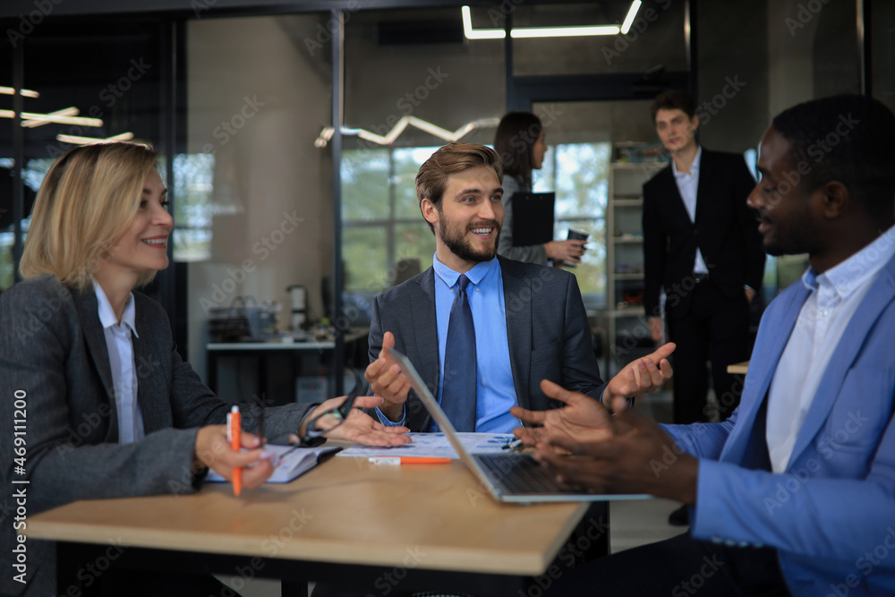 Modern business people discuss the new project at office. Modern business people discuss the new project at office.