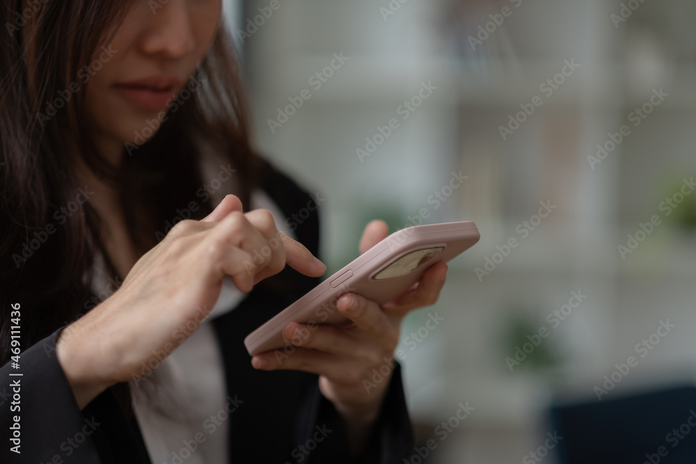 Asian girl using in hands mobile phone close up, online wi-fi internet