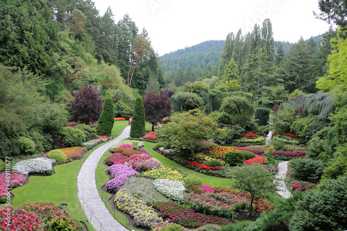 A winding path among colorful plants in the Butchar on Vancouver Island, British Columbia, Canada.
